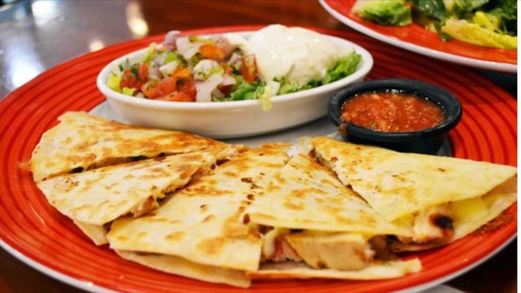 Quesadilla Supreme · Two layers of quesadilla cut into triangles  filled with cheese, steak and chicken, cooked with sautéed onions, bell peppers and tomatoes. Served with lettuce, pico de gallo, sliced avocado, rice and beans.