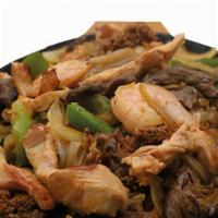 Fajitas Mexicanas · Steak, chicken, shrimp, chorizo and carnitas cooked with onions, peppers and tomatoes. Serve...