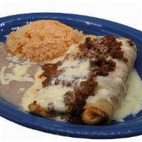 Grilled Enchiladas  · Two grilled steak or chicken enchiladas. Topped with cheese sauce & chorizo. Served with ric...