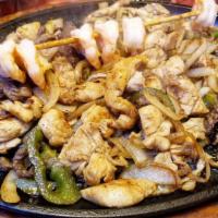 Parrillada For 2 · Tender Beef, dhicken and shrimp fajitas served with tortillas, rice and beans. Topped with l...