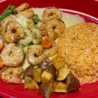 Shrimp Delight · Grilled shrimp cooked with broccoli, cauliflower, carrots and green and yellow squash served...