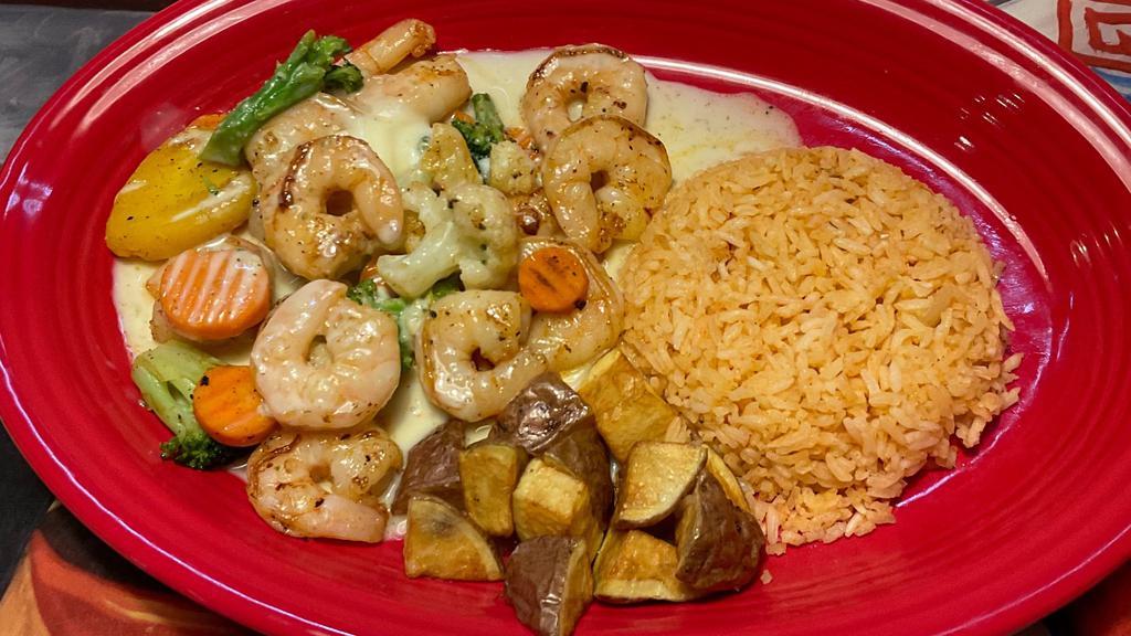 Shrimp Delight · Grilled shrimp cooked with broccoli, cauliflower, carrots and green and yellow squash served with fresh fruit and rice topped with cheese sauce.