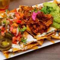 Señor Loco'S Nachos · Flour tortilla nachos with chicken, steak and shrimp with cheese sauce, topped with any topp...