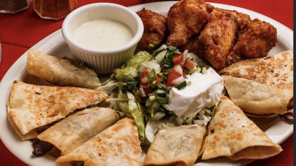 Sampler · One quesadilla, two flautas, and six chicken wings. Served with lettuce, sour cream, guacamole, pico de gallo and queso dip.