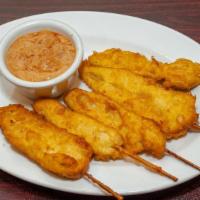 Chicken Satay · 4 pieces. Marinated chicken in curry spices, deep fried in tempura batter, served with curry...