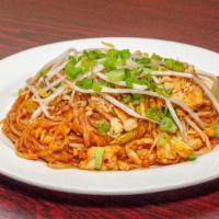 Pad Thai · Stir fried rice noodles with eggs, crushed peanuts, green onions, and bean sprout in a tamar...