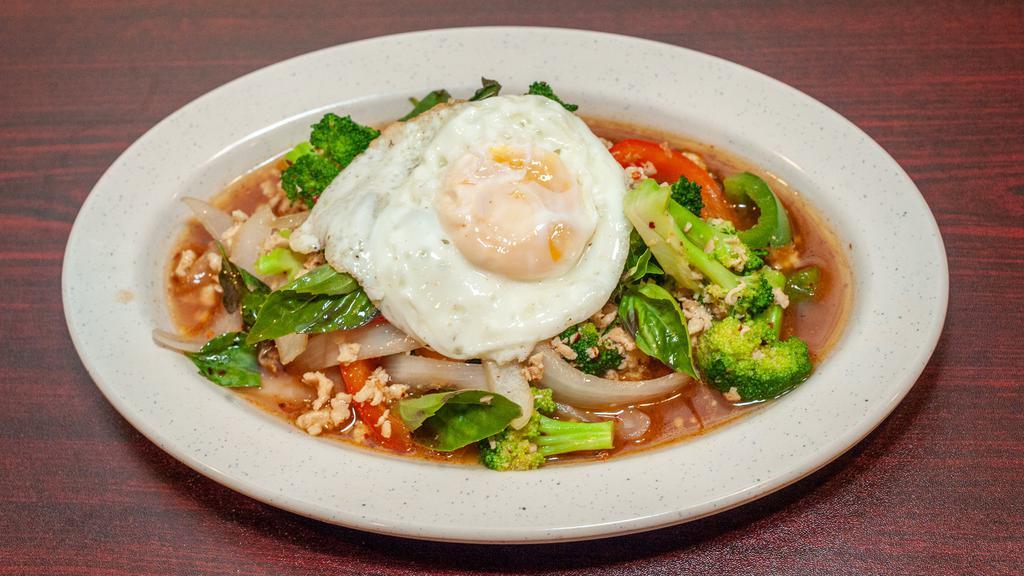 Pad Kra Pao · Basil stir fried with your choice of freshly ground meat with bell peppers, onion, and broccoli topped with a fried egg.