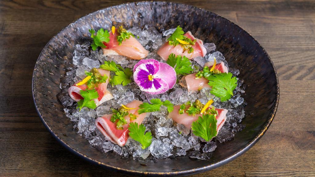 Hamachi Pesto · Yellowtail, jalapeno, cilantro, daikon, ponzu vinnegrate, pesto genovese.  This item is served using raw or undercooked ingredients. Consuming raw or undercooked meats, poultry, seafood, shellfish or eggs may increase your risk of foodborne illness.