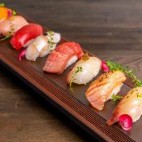 Nigiri Tasting* · Chef choice of 8pcs nigiri (8 Different cut of fishes). This item is served using raw or und...