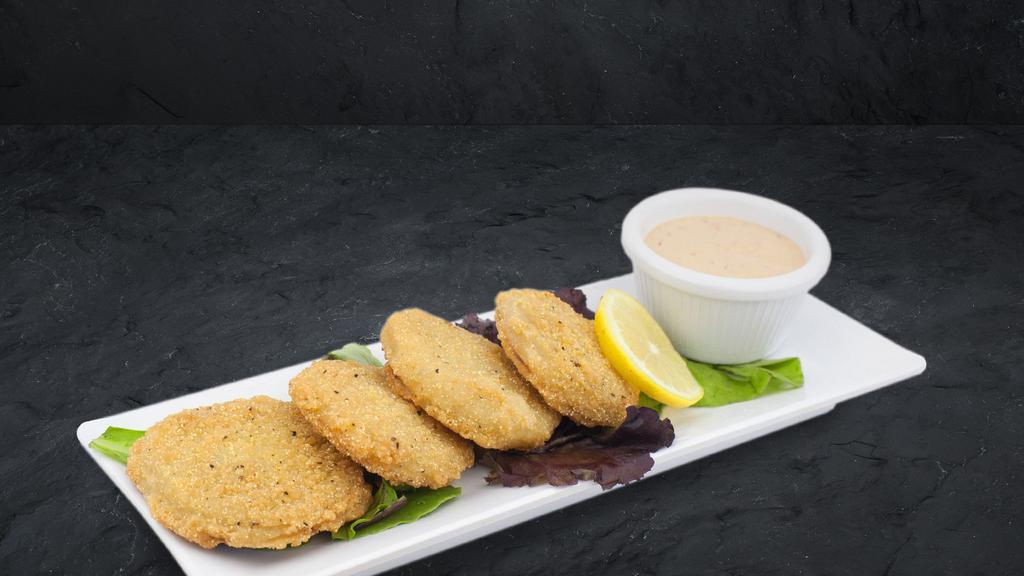 Fried Green Tomatoes  · Fresh green tomatoes lightly breaded, served with Cattleman's Petal Sauce.