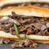Philly Cheese Steak · Grilled steak with green peppers, onion, and mushroom topped with melted provolone cheese on...