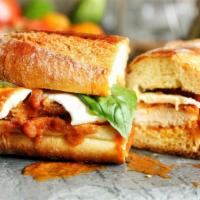 Chicken Parmesan · Toasted bread with chicken topped with marinara sauce and provolone cheese. Served on butter...