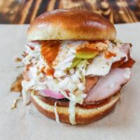 Smoked Turkey Sandwich · Hot, smoked, all-white meat turkey breast, sliced then served on a toasted bun, with our hou...