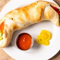 Stromboli · Fresh oven baked with any three (3) traditional toppings, mozzarella and pizza sauce.