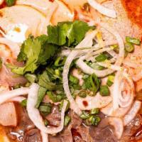 Bun Bo Hue (Spicy Noodle Soup) · Thick noodles, spicy beef broth. Served with sliced beef. shank, eye round steak*, pork meat...