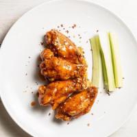 Chicken Wings · Fresh & never frozen wings hand breaded pair with one of our four mouthwatering, flavorful s...