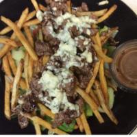 Steak And Fries Salad · Fresh mixed greens, cucumbers, and tomatoes topped with crispy hand cut fries, tender philly...