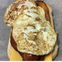 Breakfast Dog · A Hebrew 1/4 lb all beef hot dog topped with American cheese, two bacon strips, two fried eg...