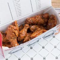 12 Chicken Wings · Served with your choice of buffalo, BBQ or sweet crunchy chili garlic sauce.