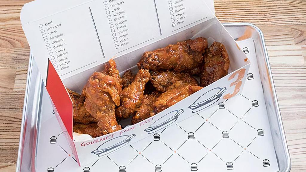 12 Chicken Wings · Served with your choice of buffalo, BBQ or sweet crunchy chili garlic sauce.
