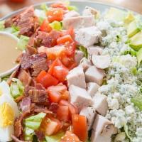 Jp Cobb Salad · Made with chopped salad greens, tomato, crisp bacon, grilled chicken breast, hard-boiled egg...