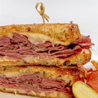 Grilled Ruben Sandwich · American grilled sandwich with corned beef, Swiss cheese, sauerkraut, and Russian dressing, ...