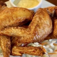 Chicken Wings (6) · Seasoned chicken wings fried to golden brown.