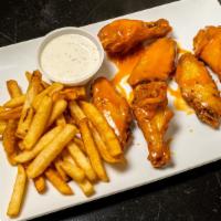 Wings · Wings are served with fries, celery, and choice of ranch or blue cheese dressing.