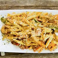 Maison · Grilled chicken, shrimp and sausage with penne noodles in our special cajun alfredo sauce wi...