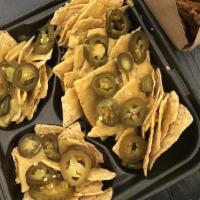 Nachos · Tortilla chips, house quinoa chili, and cheese.