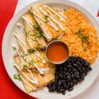 Quesadillas · Two flour tortillas stuffed with queso fundido and queso oaxaca. Topped with sour cream ad s...
