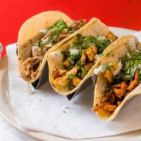 Taco (1) · Corn tortillas stuffed with your CHOICE OF FILLING, topped with cilantro and onions.