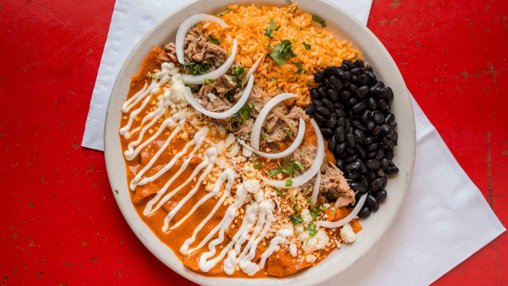 Red Chilaquiles · Local tortillas, sauteed in red chile sauce that will JUMP on you. Topped with carnitas, cheese, Mexican cream and onions. Served with Mexican rice.