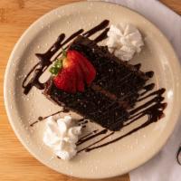 Triple Chocolate Layer Cake · Chocolate cake flavored with melted chocolate, cocoa powder, strawberries and whipped cream.
