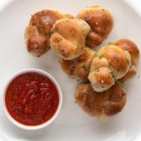 Garlic Knots (6) · Freshly baked with savory blend of fresh garlic, virgin olive oil, oregano and parsley finis...