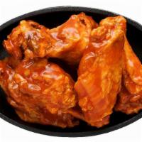 Bone-In Wings · Classic bone-in wings over-baked, cooked to order perfectly crisp, tossed with your choice o...