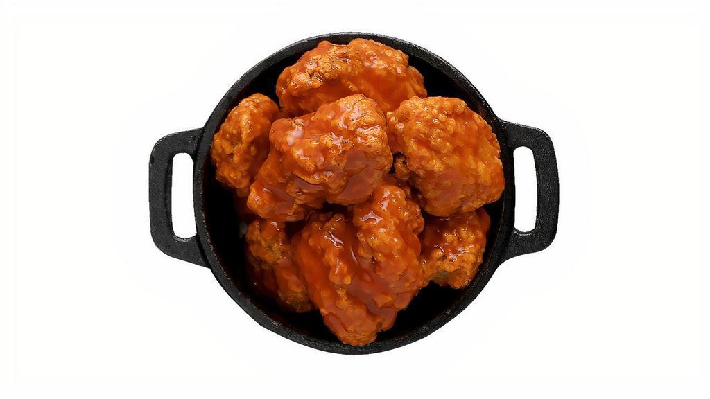 Boneless Wings · Classic boneless wings oven-baked, cooked to order perfectly crisp, tossed with your choice of delicious sauces.