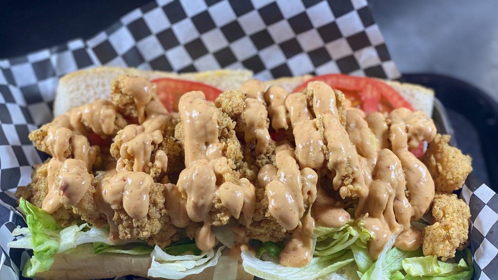 Fried Shrimp Po-Boy · Golden deep-fried with seasoned tempura batter. Dressed: lettuce, tomato, and spicy Japanese style aioli (pink sauce).