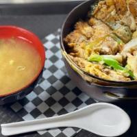 Katsu Don · Golden deep-fried panko-breaded pork, onion, and eggs cooked in sweet tangy sauce.