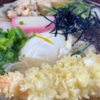 Nabeyaki Udon · Fish cake, chicken, vegetables. Egg and tempura cooked in hot soup.