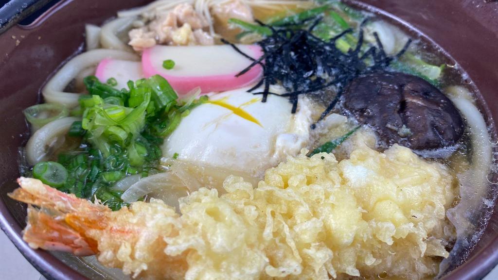 Nabeyaki Udon · Fish cake, chicken, vegetables. Egg and tempura cooked in hot soup.