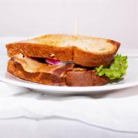 L.T Sandwich · Crisp thick cut Bacon, Lettuce, & Tomato on toasted bread.