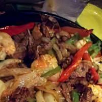 Shrimp Fajita · Shrimp cooked with onions and bell peppers served with refried beans, mexican rice and torti...