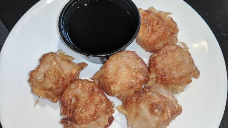Shumai · Six pieces. Shumai dumplings filled with shrimp, scallion, garlic and ginger. Steamed or fried.