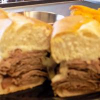 French Dip  · Roast Beef with caramelized onions, choice of cheese on a toasted roll. Served with Au Jus t...