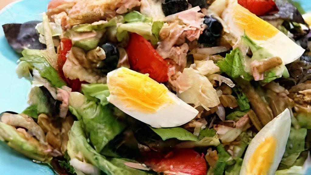 Andalusia Salad · Mixed greens, tomatoes, onions, cashews, raisins, and croutons, served with your choice of honey mustard, ranch, or house vinaigrette.