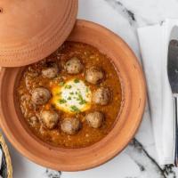 Kefta Tagine · Moroccan meatballs, homemade tomato sauce, topped with eggs and fresh herbs.