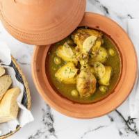 Chicken Tagine · Tender leg quarter, potatoes, preserved lemons, and green olives.