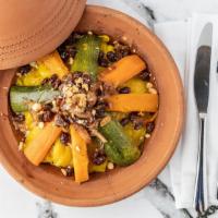 Couscous · Carrots, sweet potatoes, zucchini, and cabbage topped with caramelized onions, raisins, and ...