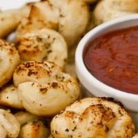 Garlic Knots (12 Pieces) · Bread, topped with garlic and olive oil or butter, herb seasoning, baked to perfection. Melt...